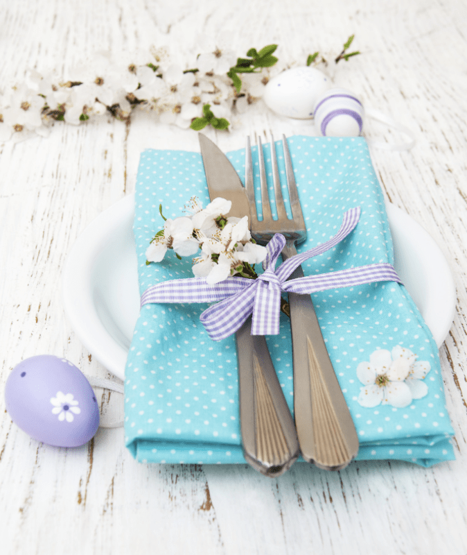 Spring Menu Ideas: turquois napkin decorated with spring flowers, easter eggs
