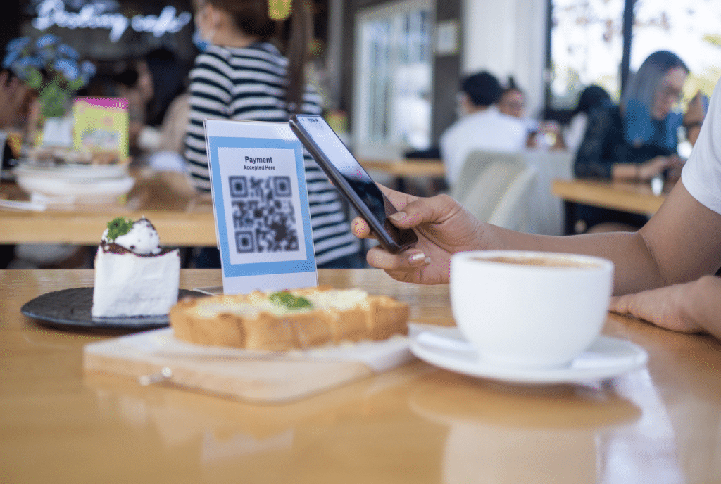 restaurant trend: Restaurant Customer Scanning QR Code for Payment