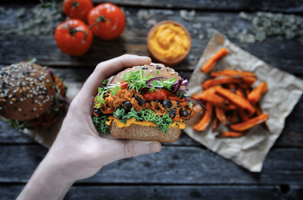 plant-based food: hand holding vegan burger